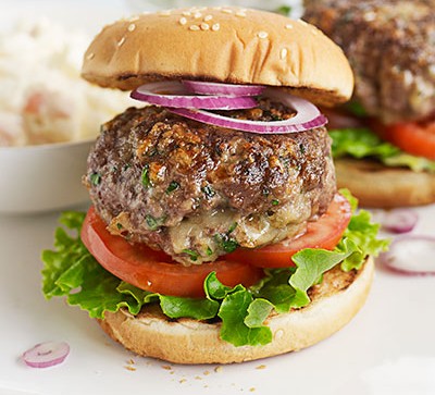 cheeseburger on white counter