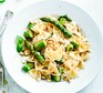 Asparagus, chilli & feta farfalle on a white plate