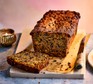 Fruit cake with the first slice cut