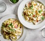 Two bowls of chicken and bacon pasta