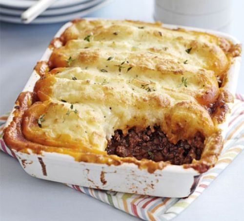 Cottage pie recipes Cottage pie with spoonful taken out in a square casserole dish