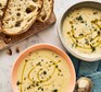 Two bowls of creamy cauliflower soup