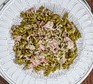 Pea fusilli with ham & mustard sauce served on a plate