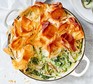 Herby spring chicken pot pie in a casserole dish