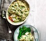 Fish pie with pea & dill mash served in a casserole dish with broccoli