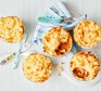 Five mini shepherd’s pies on a white table