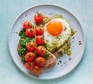 A serving of healthy pesto eggs on toast