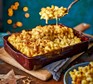 Cheeseboard mac ’n’ cheese in a baking dish with cracker breadcrumbs