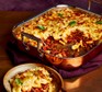 Macaroni cheese lasagne served in a large serving dish