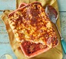 Veg-packed meatball lasagne served in a casserole dish