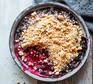 A dish serving peanut butter berry crisp