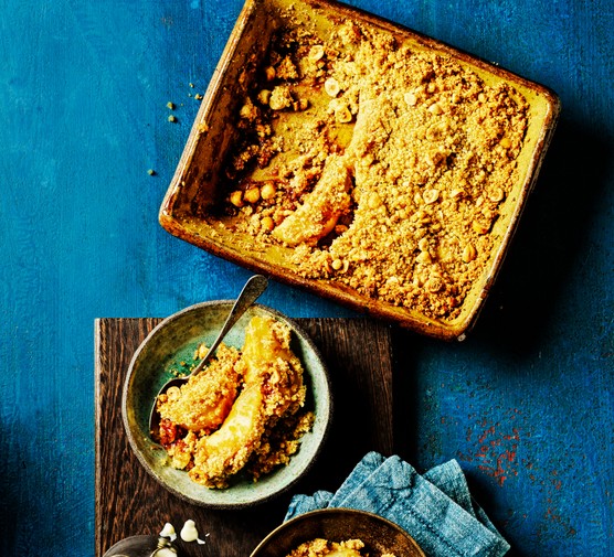 Pear crumble in a baking dish and served in bowls Pear crumble in a baking dish and served in bowls