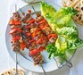 Pork souvlaki served on a plate