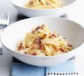 Two bowls of spaghetti carbonara without cream