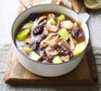 Cock-a-leekie soup in a white pan