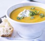 Vegetable soup in a bowl with crusty bread