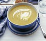 Boxing Day soup swirled with cream in a blue bowl