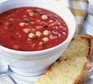 Autumn vegetable soup in a bowl with cheesy toasts