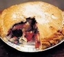 Blackberry and apple pie with section taken out