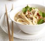 Curried turkey noodle soup in bowl
