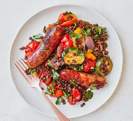 Sausage, roasted veg & puy lentil one-pot A plate serving sausage, roasted veg & puy lentil one pot