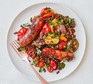 A plate serving sausage, roasted veg & puy lentil one pot