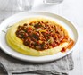 Cheesy polenta with sausage ragout