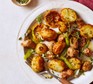 Sausages with lemon & rosemary roast potatoes served on a large plate