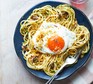 Spaghetti with smoked anchovies, chilli breadcrumbs & fried egg served on a plate