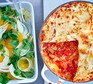 Speedy chorizo ragu lasagne served in a dish with a salad alongside