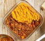 A casserole dish serving sweet potato-topped cottage pie