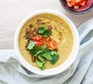 Lentils and herbs in bowl with tomatoes