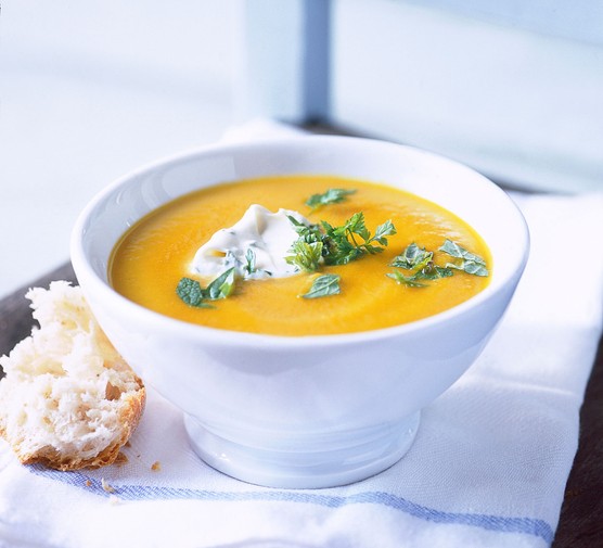 Vegetable-soup-recipes Bowl of vegetable soup topped with yoghurt and parsley