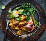 A plate serving lamb vindaloo
