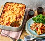 Whipped ricotta, spring onion & leek matzo lasagne in a large casserole dish