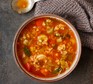 Bowl of vegetable & lentil soup with spoon