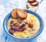 potato soup in a bowl with bread